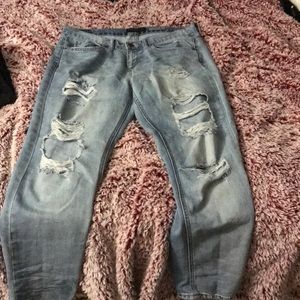 Light blue jeans with holes